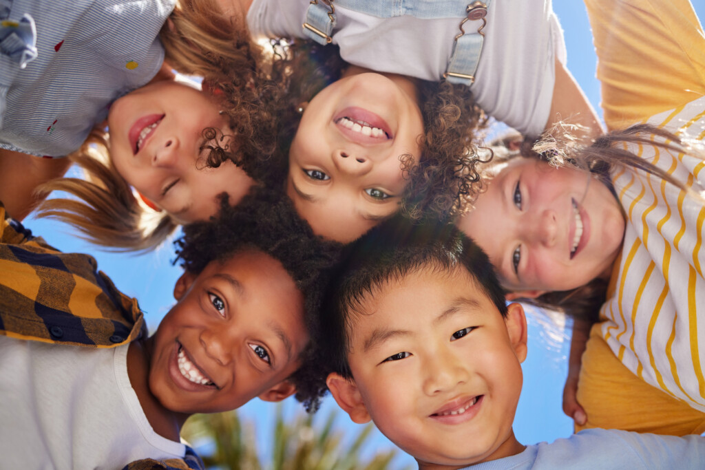 group of kids at summer camp smiling at camera