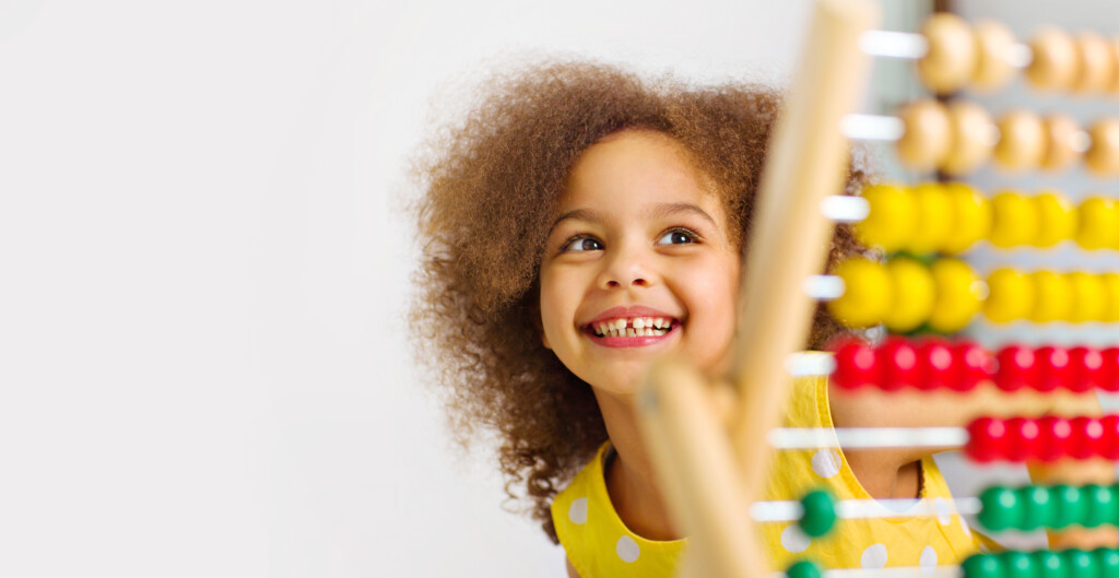 a young child with abacus, for article on sprouts child development