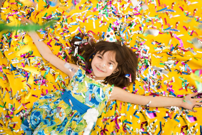 girl in pile of confetti, for list of new year's events in tulsa