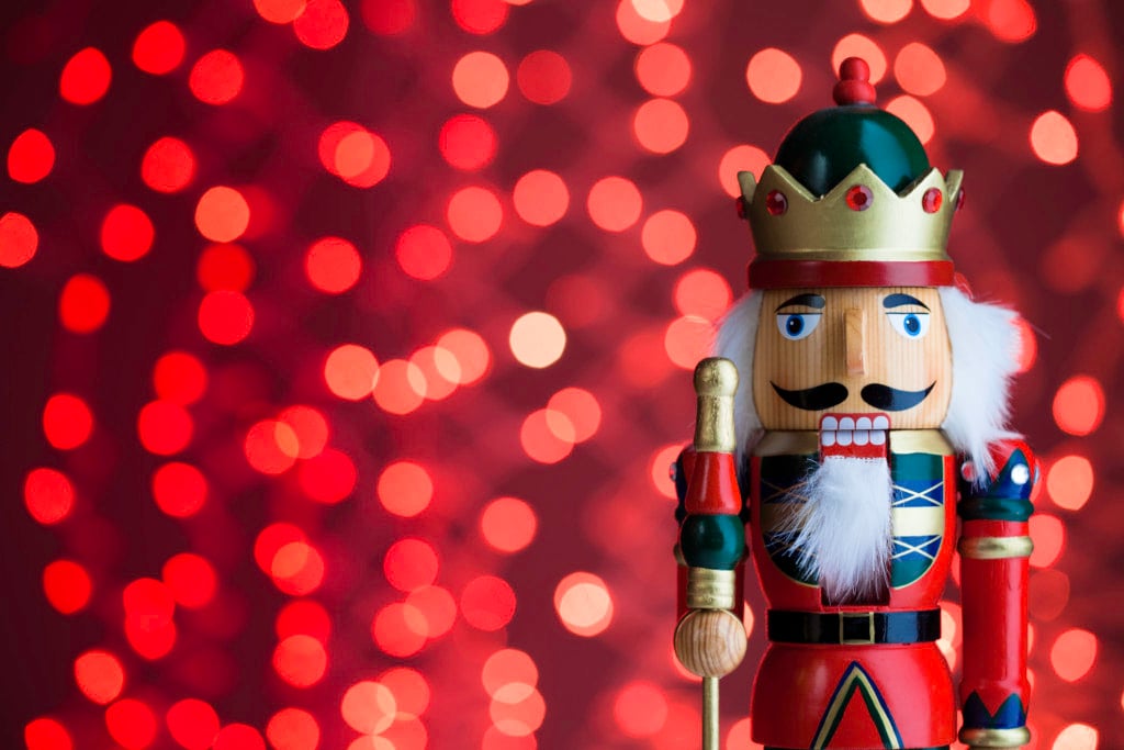 photo of a nutcracker on red background, for list of christmas shows in tulsa