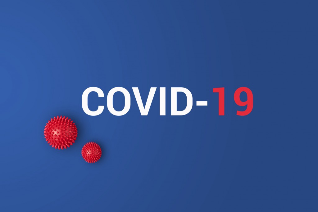 Iinscription Covid 19 On Blue Background With Red Ball