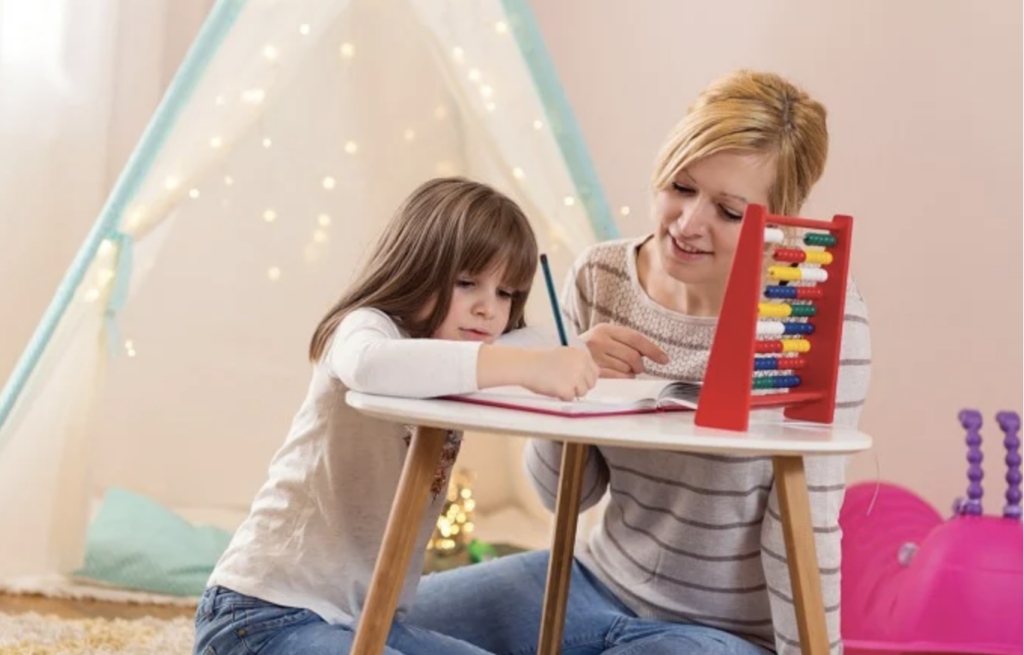 a mom helping her child with math