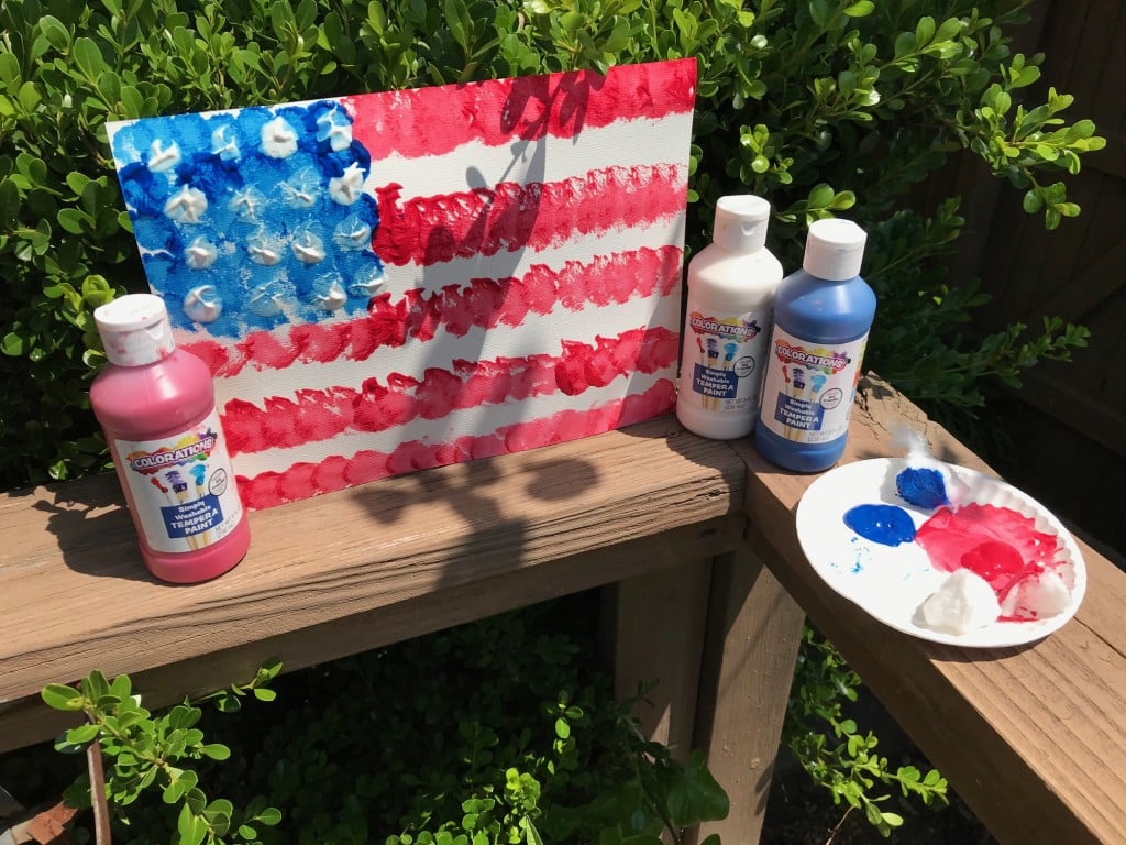 a painted united states flag, one of this article's memorial day activities to do with kids