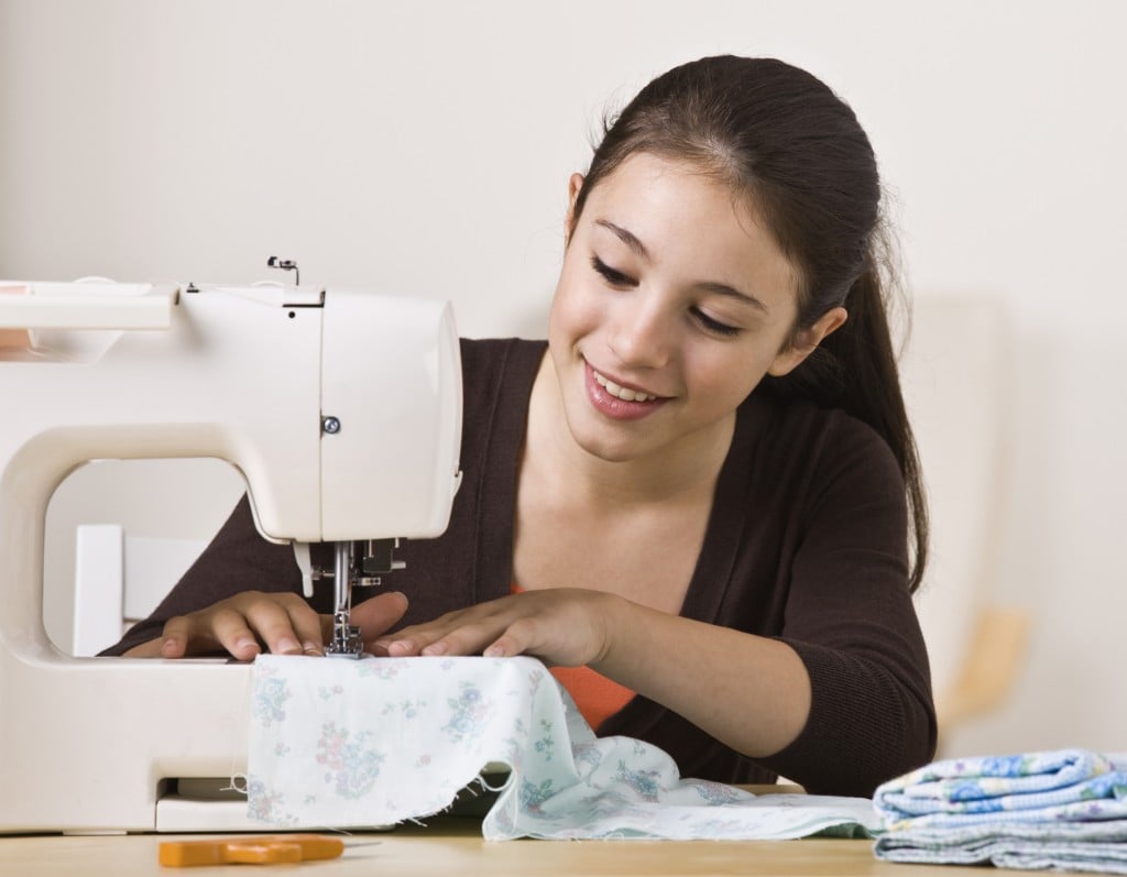 Beautiful Young Girl Sewing