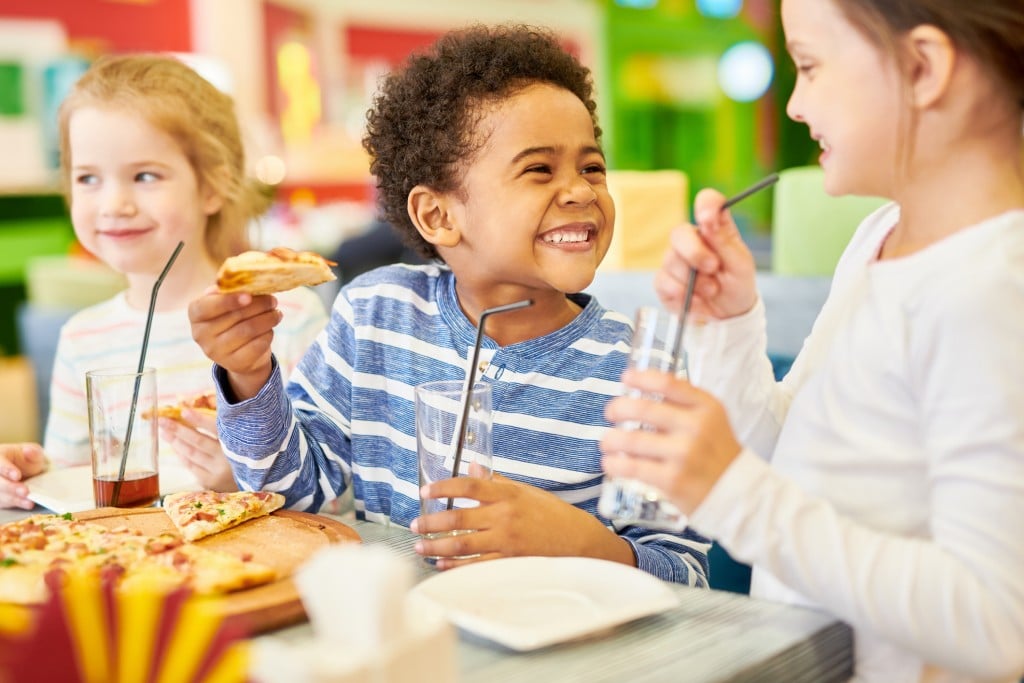 Happy Children In Pizzeria