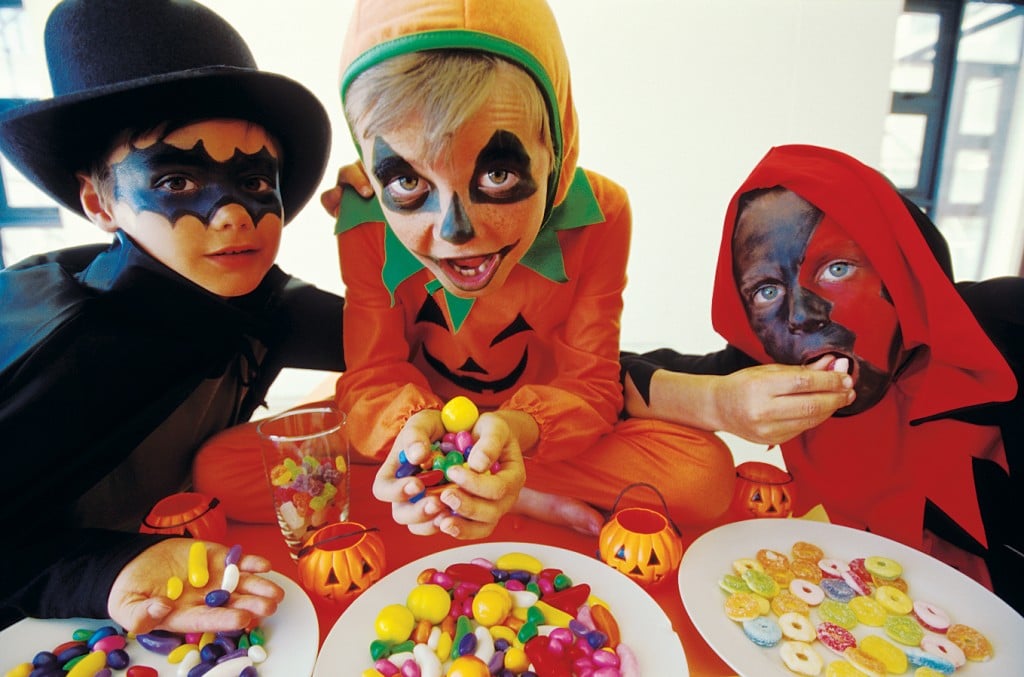 kids with lots of halloween candy. sugar high concept