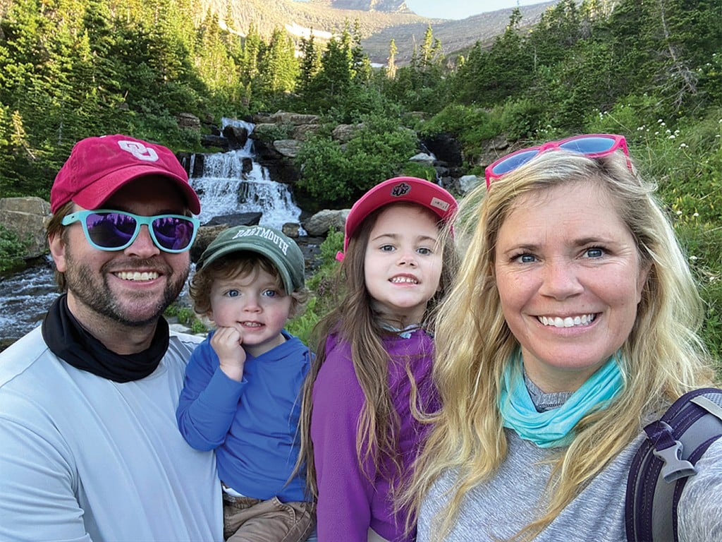 lindsay hutchison with her family on a hiking trip