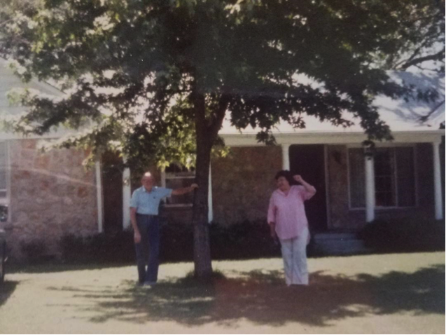diane morrow kondos parents in front of a house, for article on parents' deaths