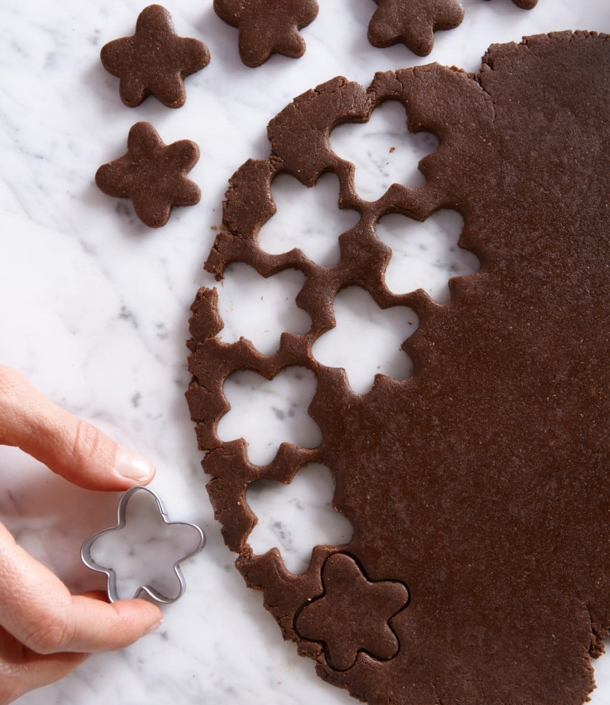 cutting star shapes from chocolate cookie dough, for article on simple recipes