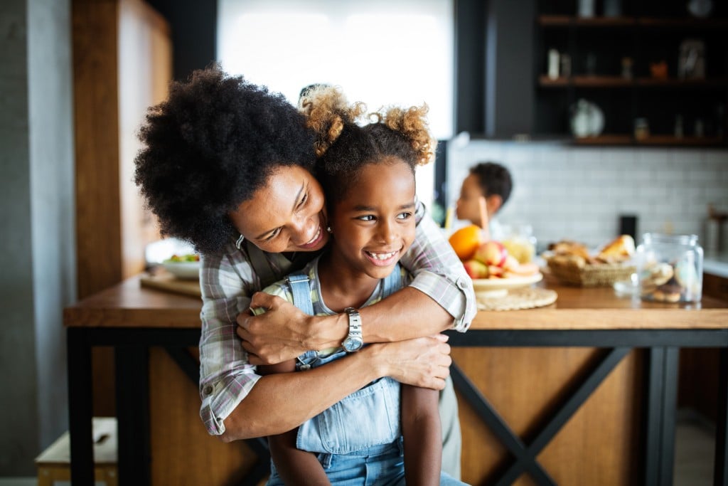 Happy Mother And Children In The Kitchen. Healthy Food, Family, Cooking Concept