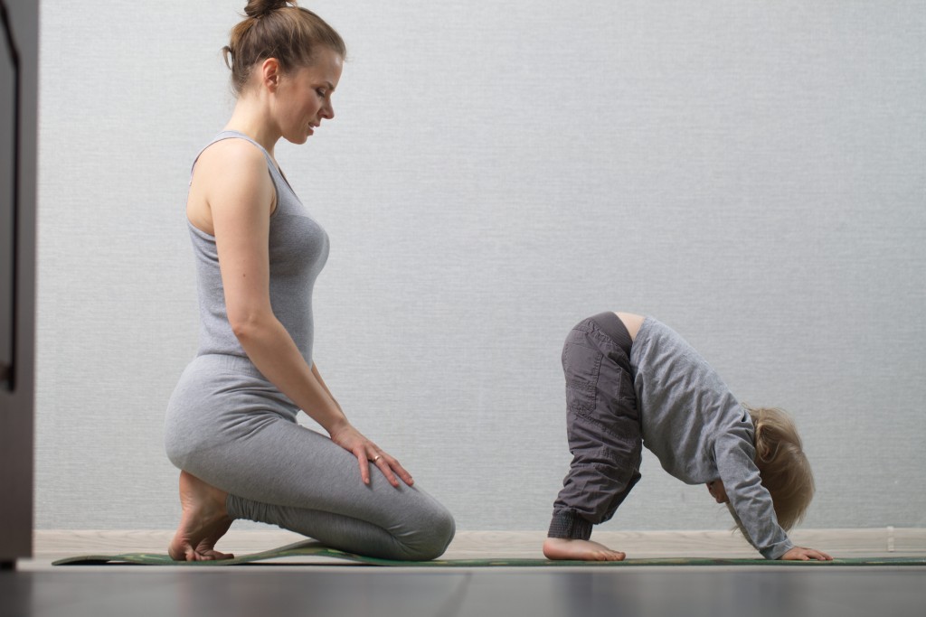 Hatha Yoga Fitness Mother With Baby