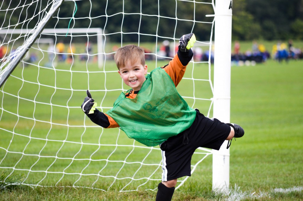 Boy Playing Youth Soccer Outdoors