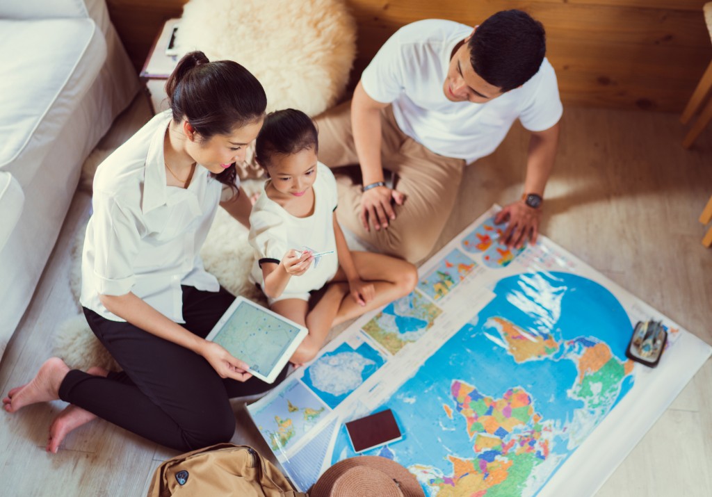 Asian Family Are Planning To Around The World. The Image Focus Plane Was Carrying A Child.