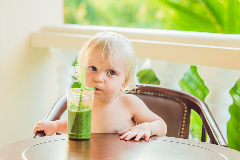 Child Boy Drinking Healthy Green Vegetable Smoothie Healthy Eating, Vegan, Vegetarian, Organic Food And Drink Concept