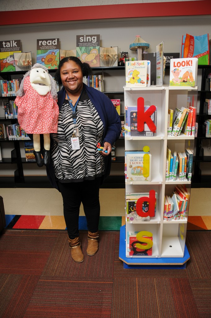 Tiffany Willis with a puppet at the library, for article on books that teach kids emotional intelligence
