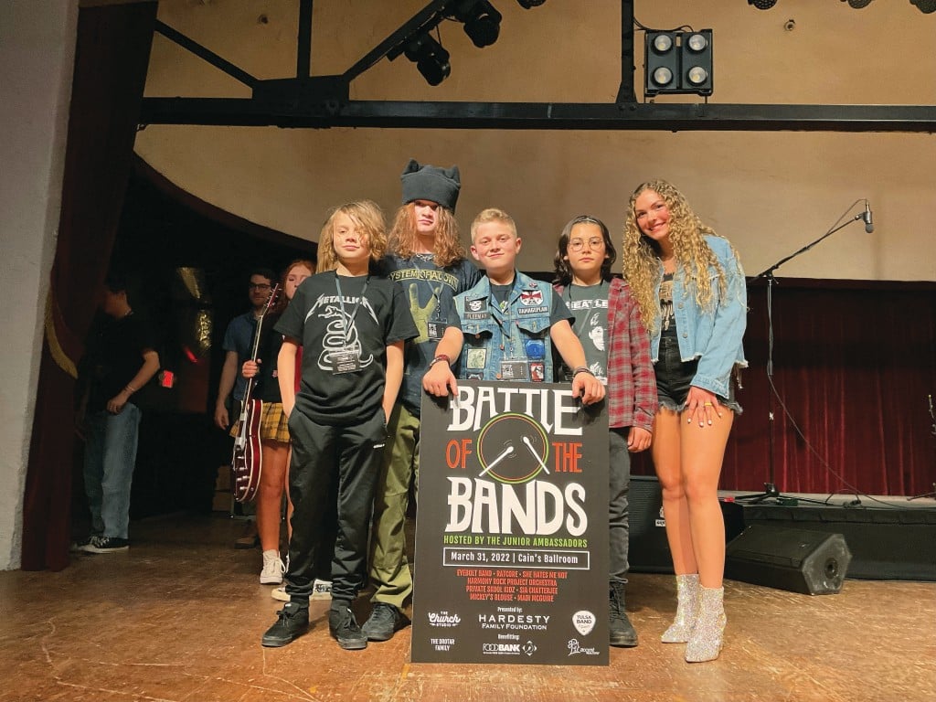 Battle of the Bands Judge’s Choice winner She Hates Me Not band members with Singer/Songwriter winner Madi McGuire