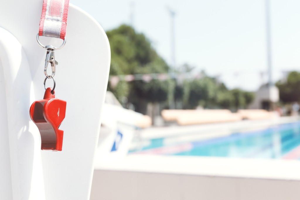 Coach Whistle Near Swimming Pool.