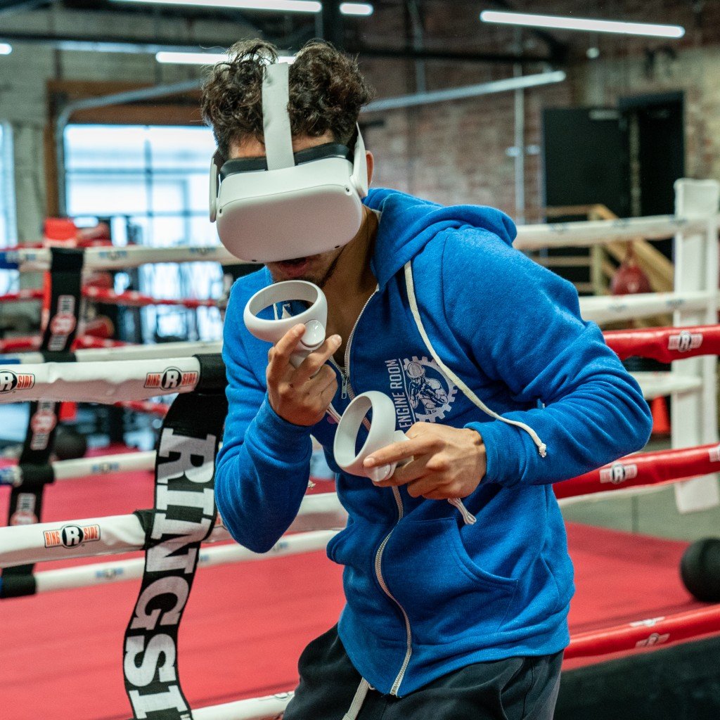 Pro boxer David Perez trains with a virtual reality boxing game.