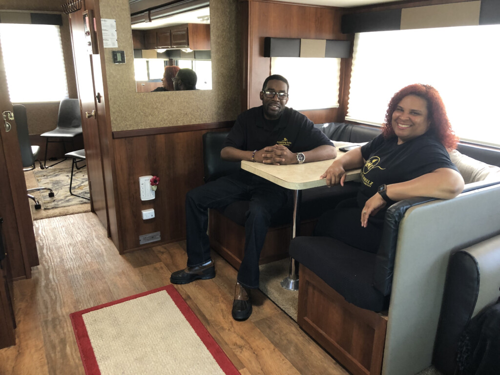 Michael McCalister, LPC, and Marnie Jackson sit inside the mobile mental health clinic skillz on wheelz
