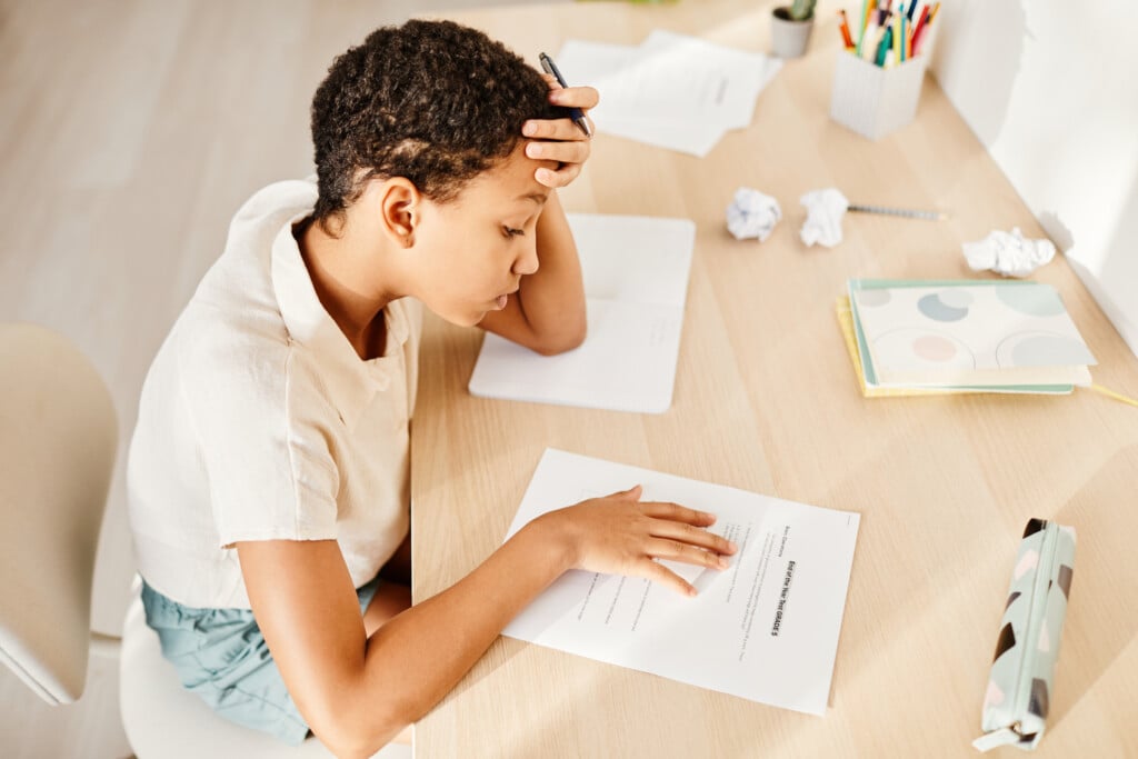 Girl Preparing For Test At Home, for article on back-to-school anxiety