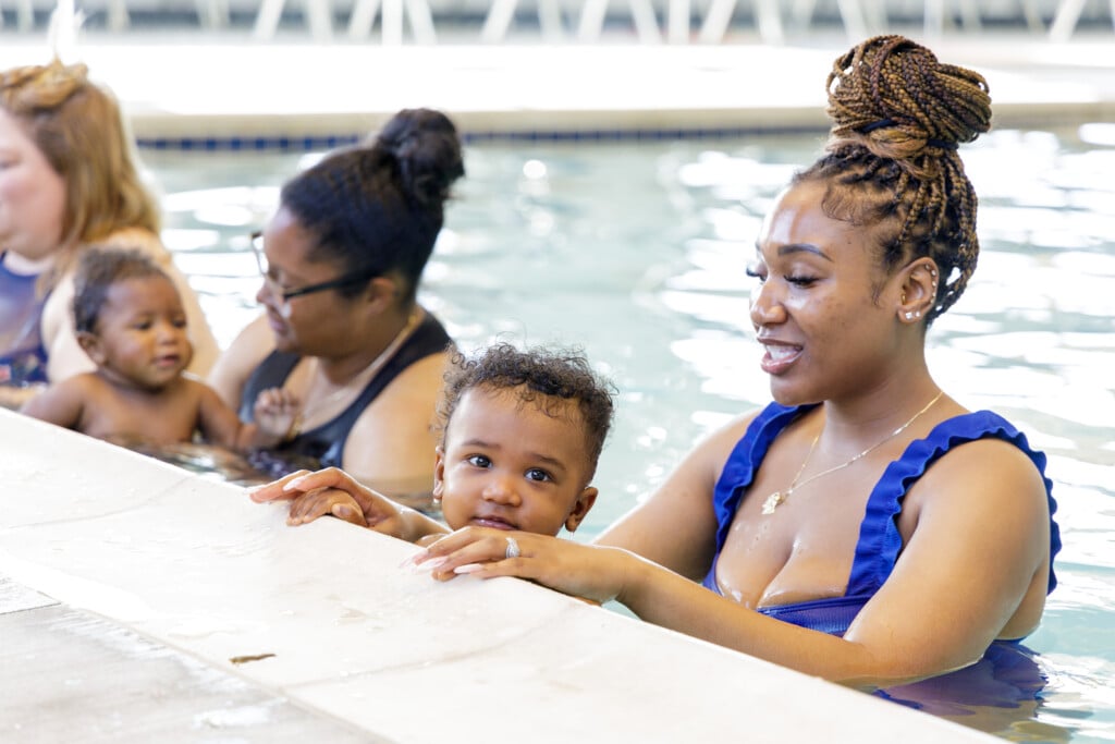 babies and their moms taking swim lessons at miller swim school