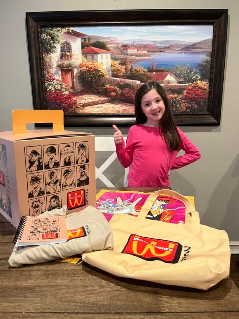 Isabelle shows off items from her WcDonald’s mystery box