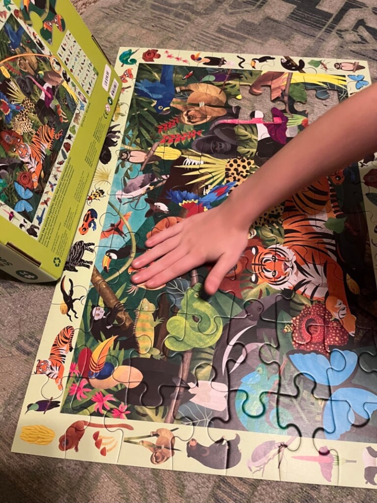 a child completing a puzzle, for a list of screen-free activities