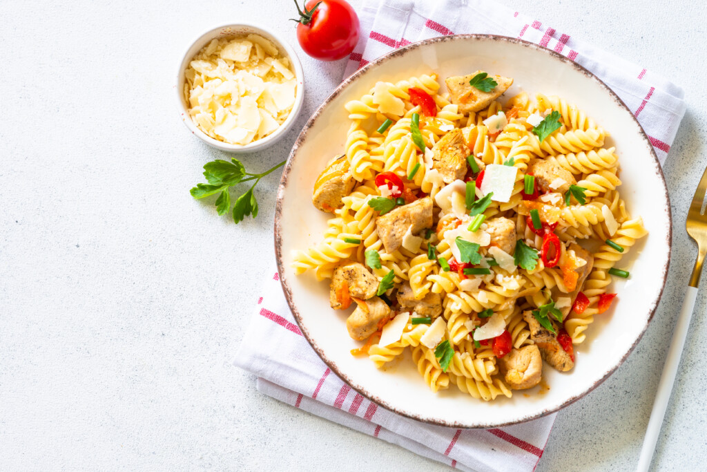 Italian Pasta With Tomato Sauce, Basil And Parmesan Cheese On White Table.