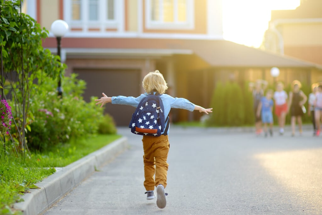 Little Schoolboy Joyfully Running To School