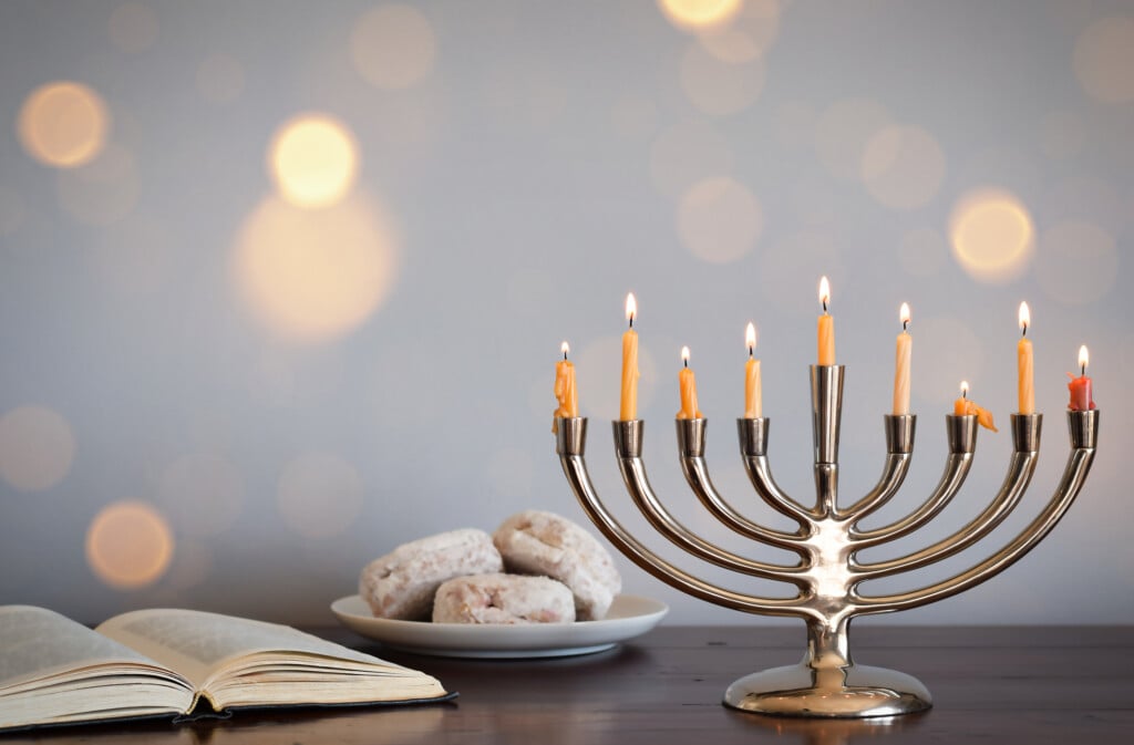 Hanukkah Menorah With Jelly Doughnuts And Torah.