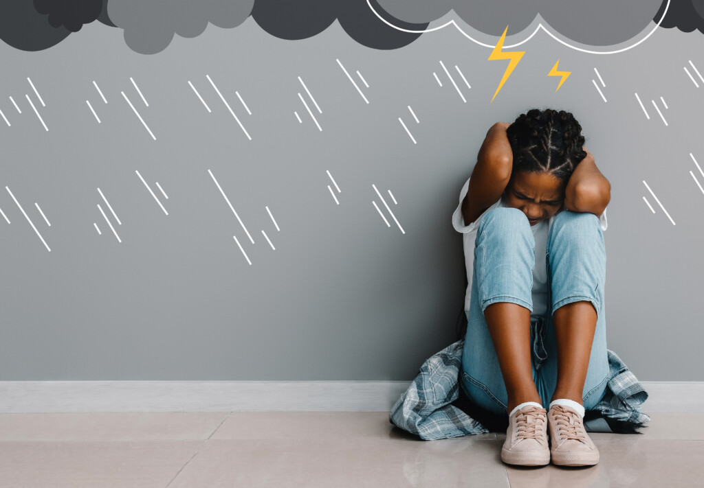 a young girl scared of storms, represented by drawings on a gray background