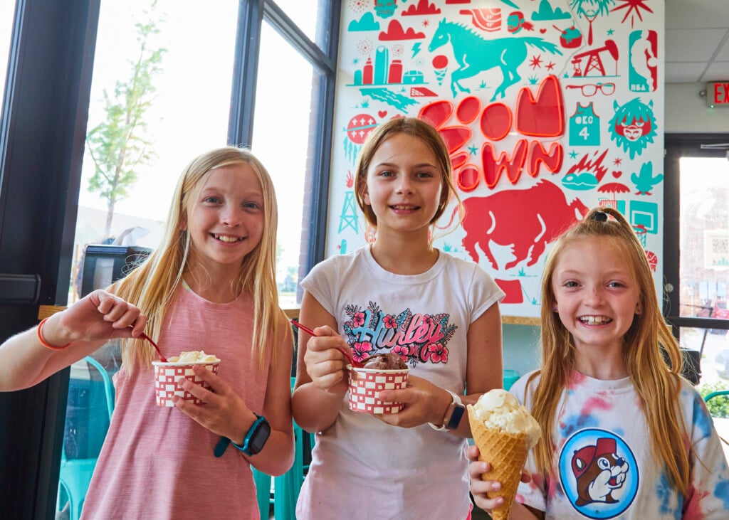 Three girls eating ice cream at Boomtown Creamery in OKC