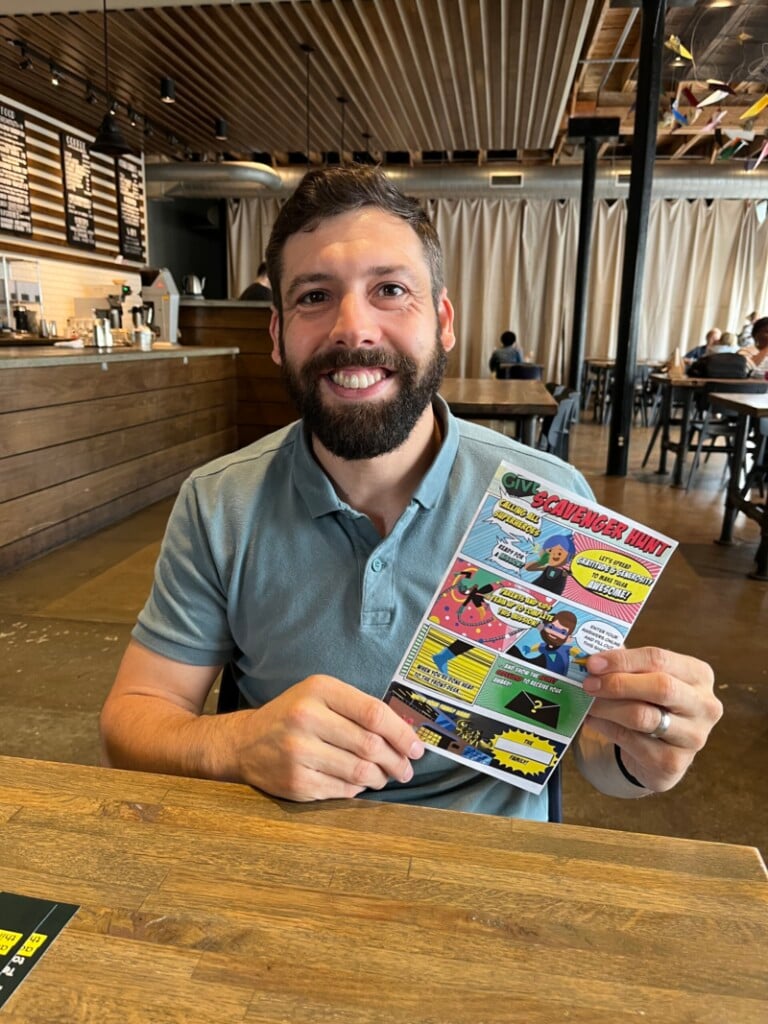 Andy Wilkinson, product manager for Givt, holding a Givt comic