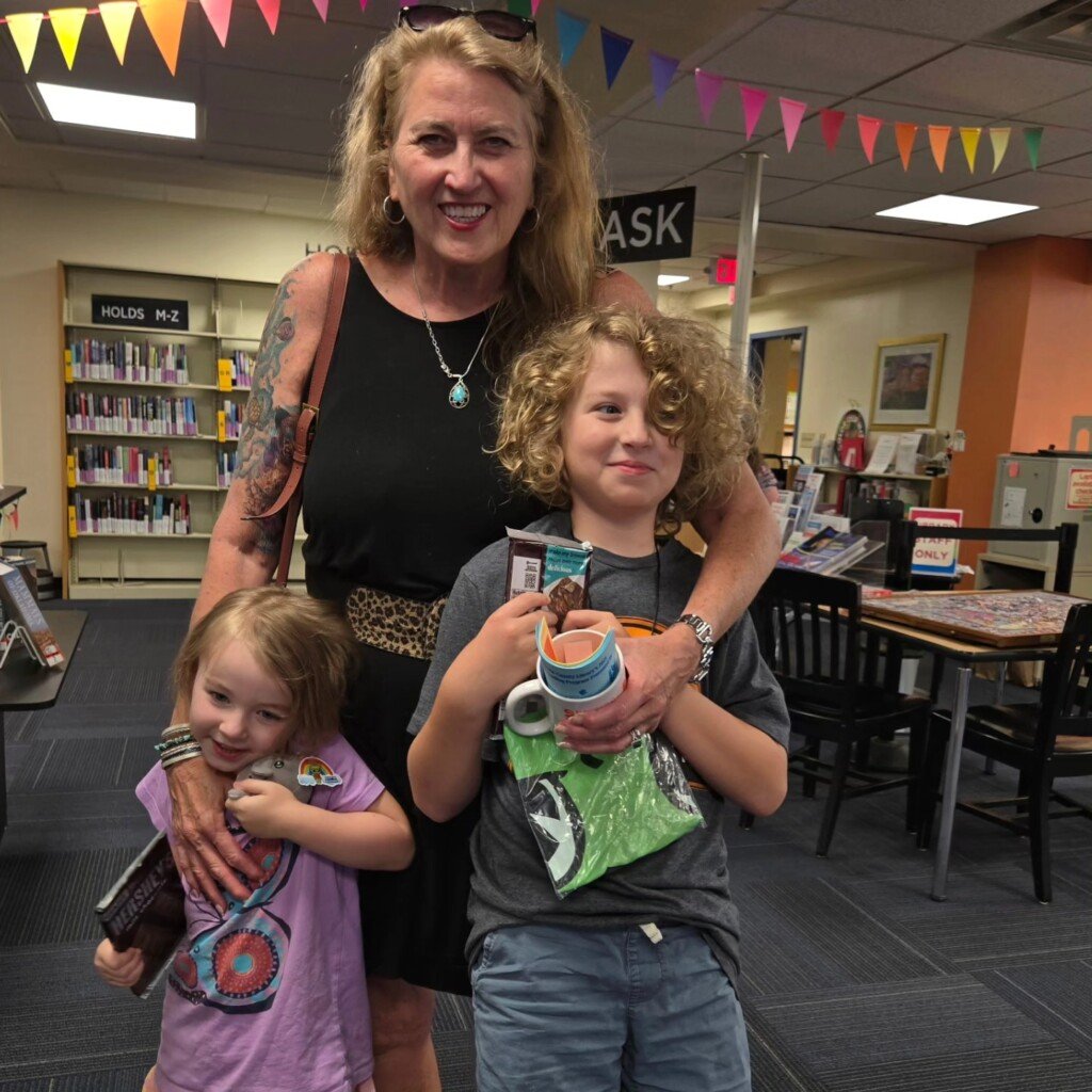 Diane and her grandkids at the library