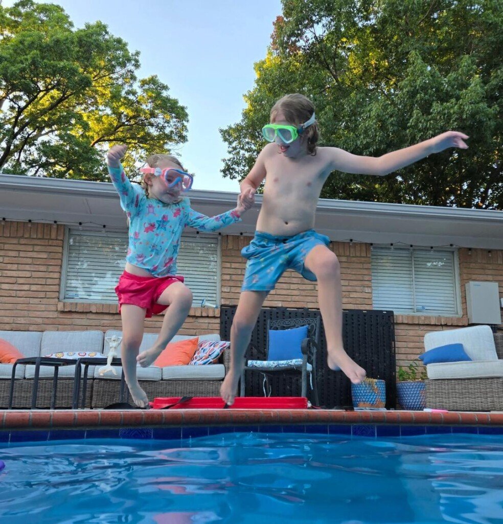 Cal and Sylvia jumping into the pool