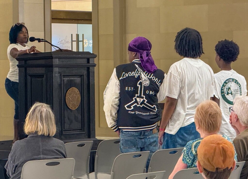 Dr. Tamecca Rogers speaking at the State Capitol.