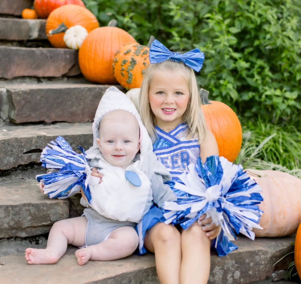 two young children in costumes on the steps of the philbrook tempietto