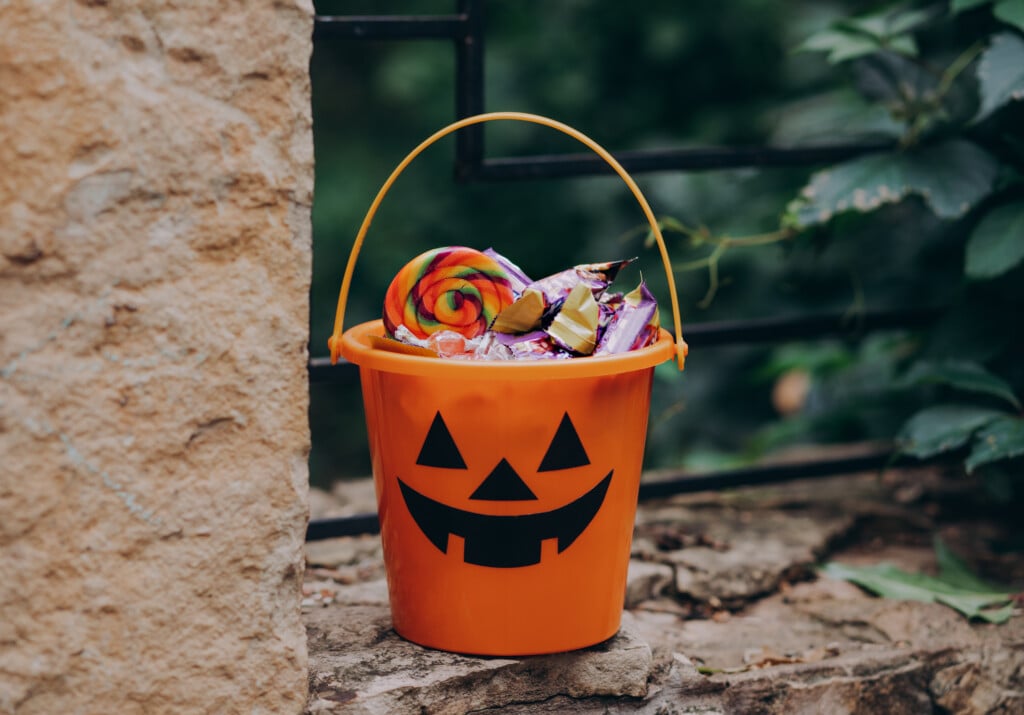 Halloween Jack O Lantern Orange Bucket filled with candy