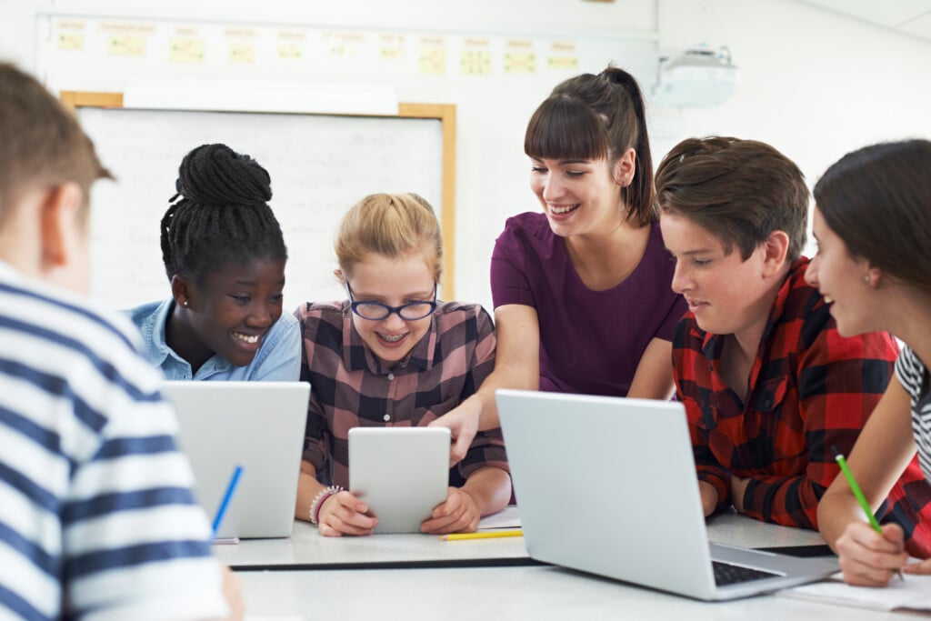 Teens around a table, youth advisory board