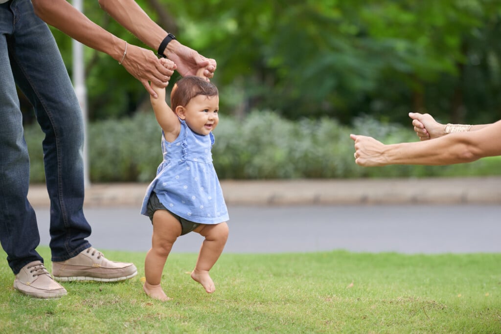 a baby taking their first steps