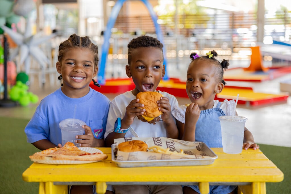 three kids eating on the patio at mother road market in tulsa