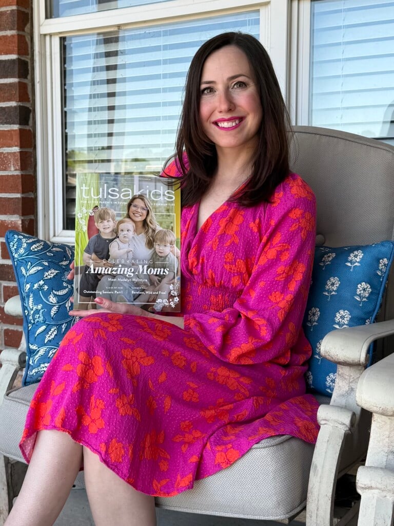 amanda murphy holds a copy of tulsakids magazine's may issue
