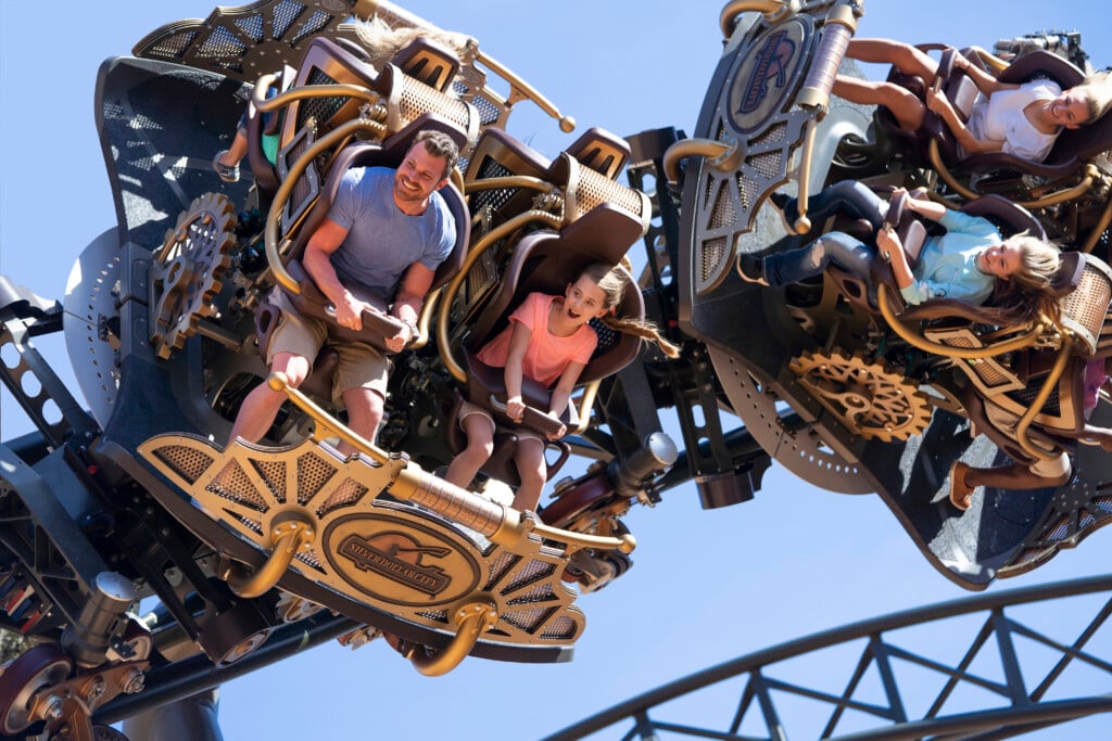 families on the time traveler roller coaster at silver dollar city theme park