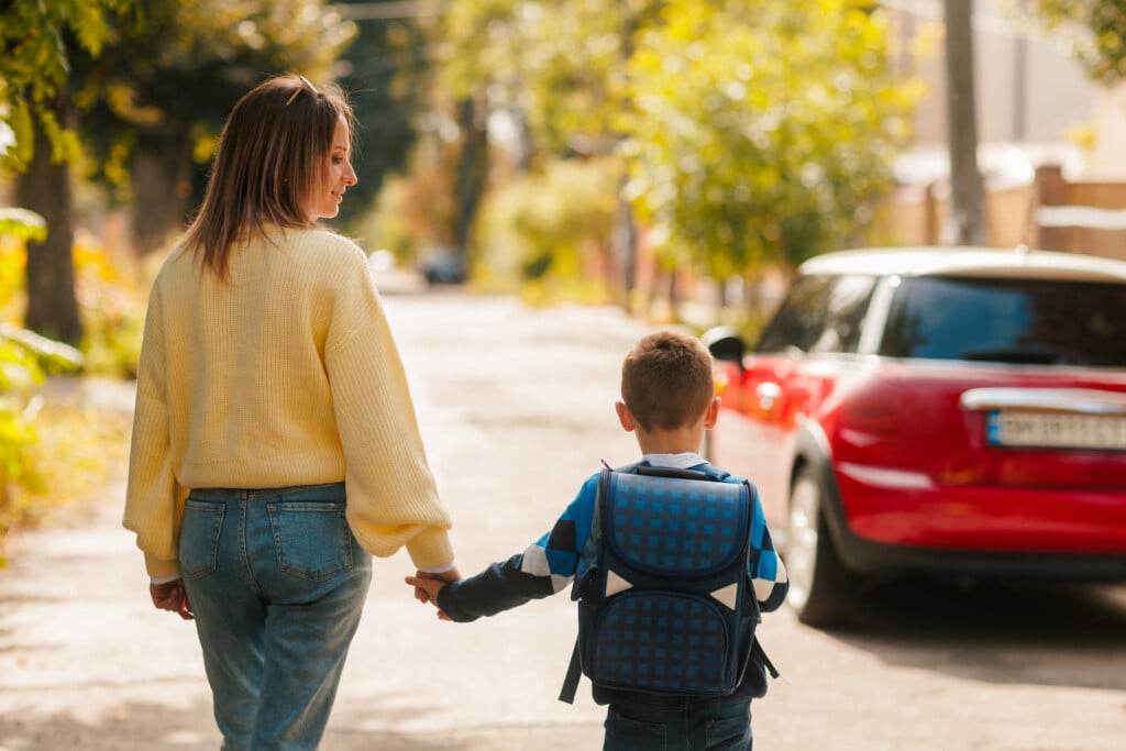 mom and son walking to school