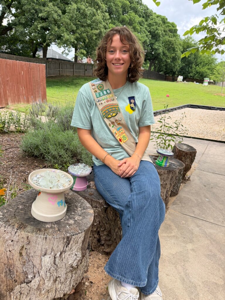 Ruby Anton sitting outside and smiling