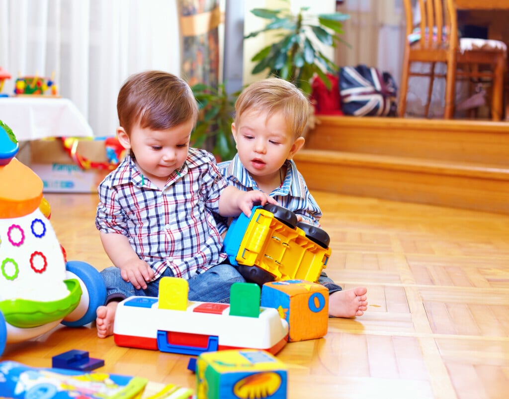 two toddlers playing together