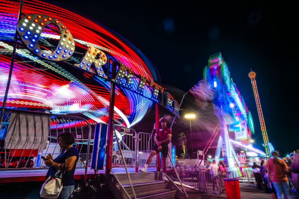 rides lit up at night at the tulsa state fair