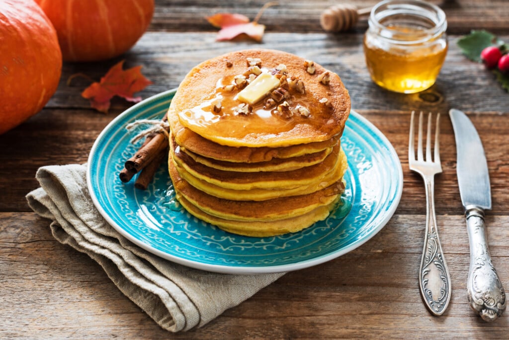 a stack of pancakes on a blue plate
