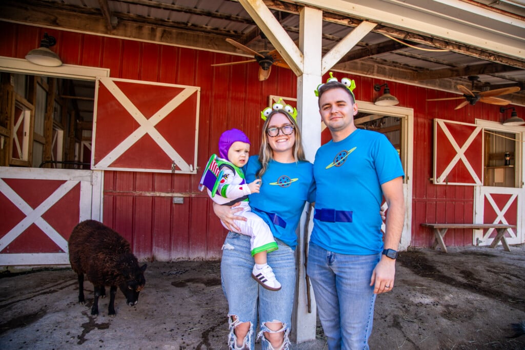 a family in the petting zoo at HallowZOOeen