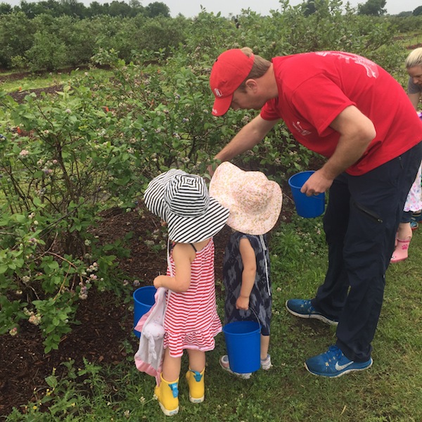 the twins picking berries at thunderbird berry farm